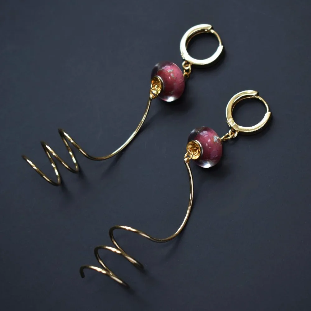 Unmatched earrings dangle, large spiral earrings gold tone